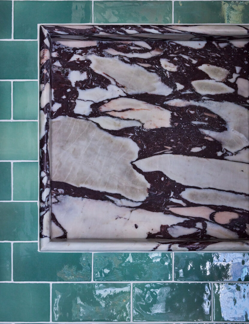 Designer: Lark + Palm | Photographer: John Merkl | Materials: Micro Moons Black Stone Mosaic, Calacatta Viola Marble, Café Morocccan Mint Tile Slab