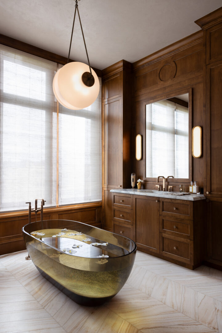 Designer: Lauren Berry | Photographer: Bess Friday | Materials: Calacatta Borghini Honed Marble, Vanilla Onyx Vein Cut Honed Chevron Slab