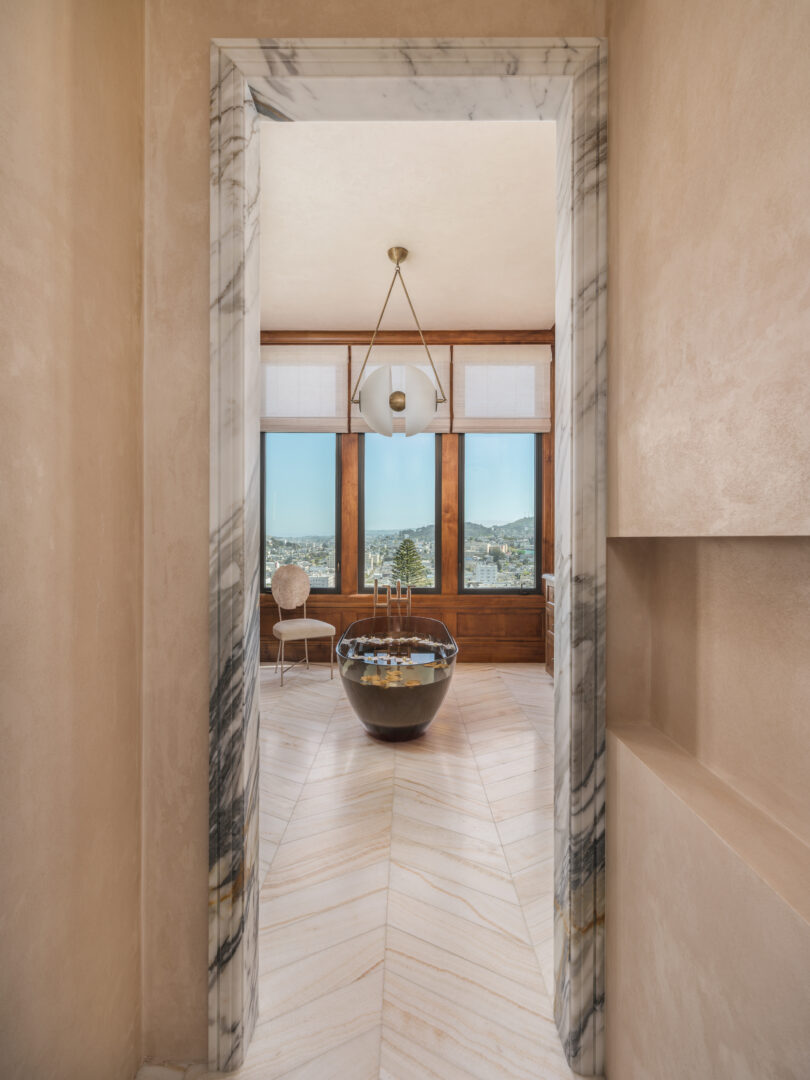Designer: Lauren Berry | Photographer: Christopher Stark | Materials: Calacatta Borghini Honed Marble, Vanilla Onyx Vein Cut Honed Chevron Slab