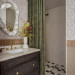 Designer: Kendra Nash | Photographer: Christopher Stark | Materials: Siena Beige Agarwood Limestone Tumbled Mosaic, Agarwood Limestone Honed, Omega Black Brushed & Pollowed Edge Slab