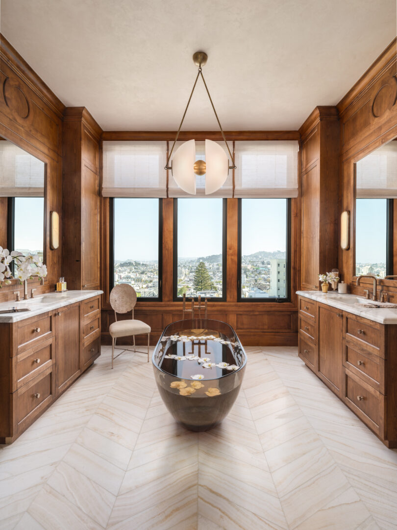 Designer: Lauren Berry | Photographer: Christopher Stark | Materials: Calacatta Borghini Honed Marble, Vanilla Onyx Vein Cut Honed Chevron Slab
