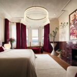 Designer: Castellanos Interiors | Photographer: Jose Manuel Alorda | Contractor: Castellanos Construction | Material: Rosso Levanto Marble (fireplace & side tables) Slab
