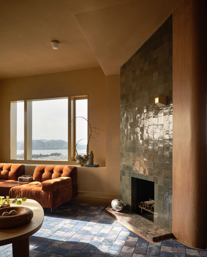 Designer: AubreyMaxwell Design & Perez Construction | Photographer: R. Brad Knipstein | Materials: Breccia De Vendome Marble (countertop); Juniper Zellige Tile (fireplace) Slab